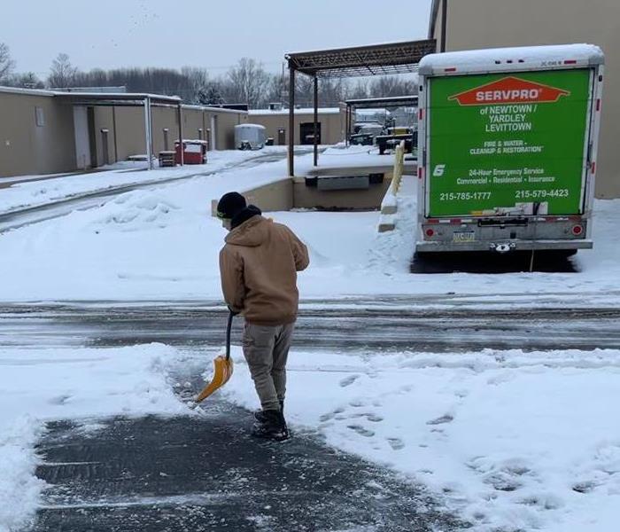 guy shoveling snow